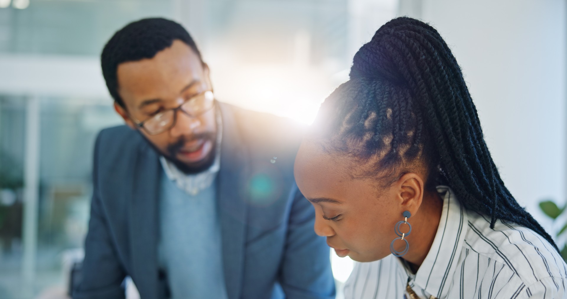 Collaboration, training and a business team planning in the office while talking about ideas together. Teamwork, communication or coaching with a mentor and employee in the workplace for discussion